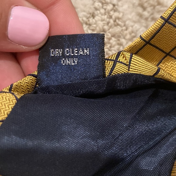 It is a Harold Powell tie originally prices $35. Gold & black checkered pattern. - Picture 4 of 5